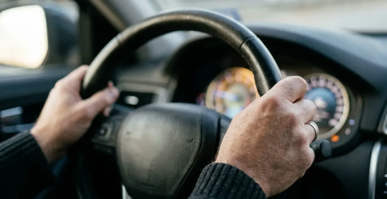 Close-up view of an electric vehicle driver monitoring real-time efficiency metrics during efficient driving