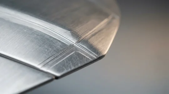 Close-up of modern car bonnet engineered crumple zone protecting pedestrian during impact