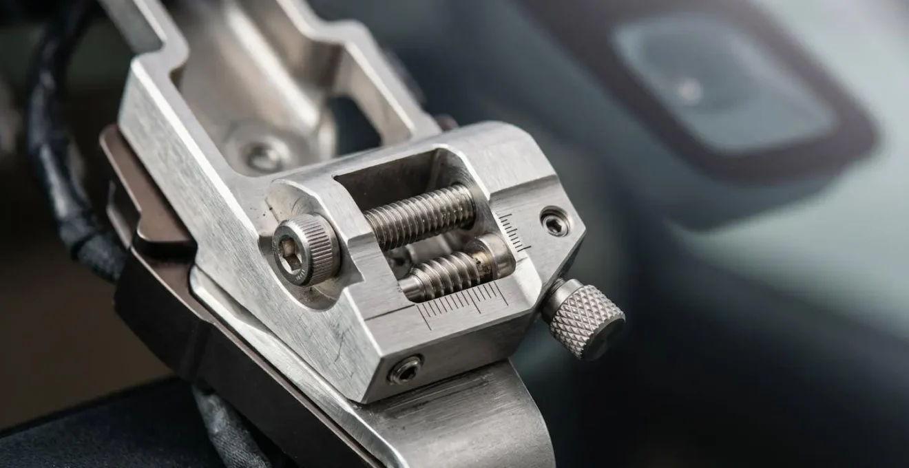 Close-up technical view of ADAS camera mounting bracket during windshield calibration process