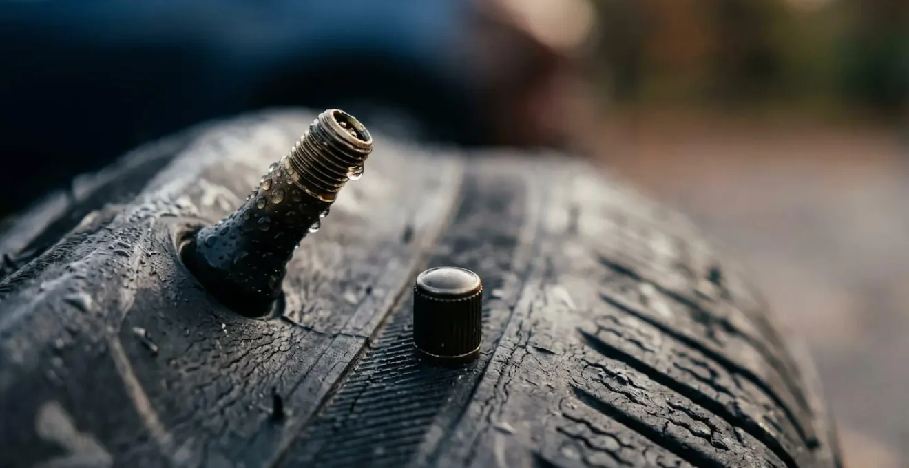 Macro shot of tire valve with condensation representing cold autumn air temperature effects