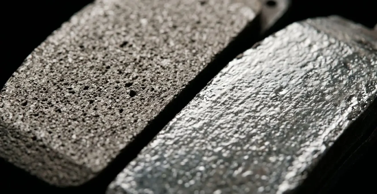Detailed comparison showing the microscopic surface difference between properly bedded and glazed brake pad friction material