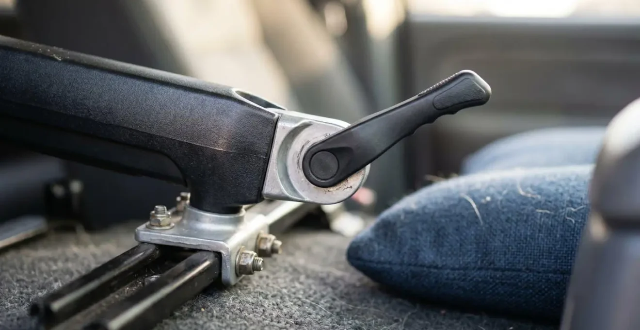 Close-up view of adjustable laptop mount installed on vehicle passenger seat with neutral positioning